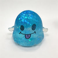 Blue glitter smiley ghost squishy