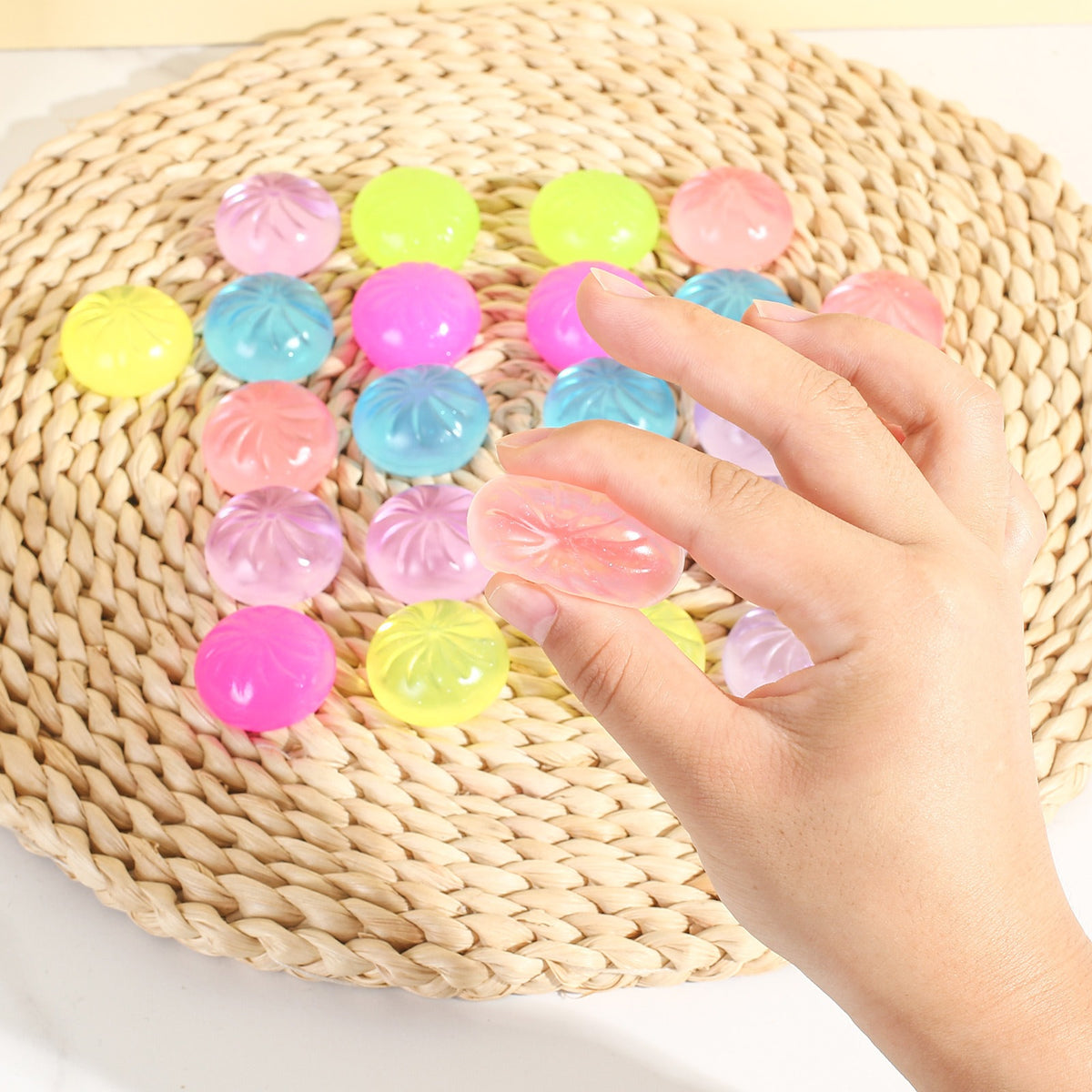 Hand squeezing mini glitter squishies from the advent calendar